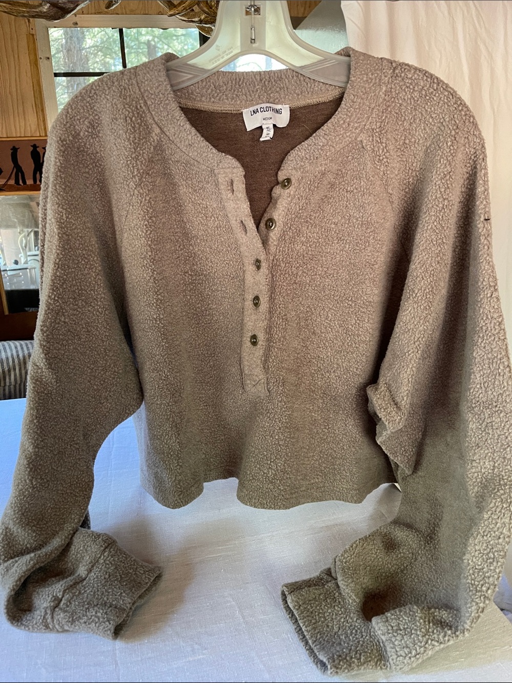 Tan button front sweatshirt.